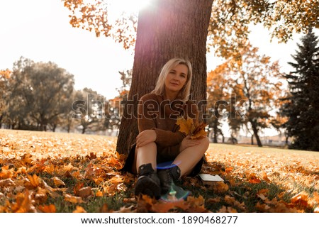 autumn photo shoot of a girl in a sweater