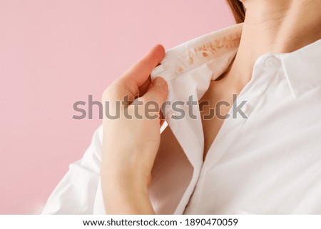 Hand showing dirty sweat and cosmetic stain . High quality photo