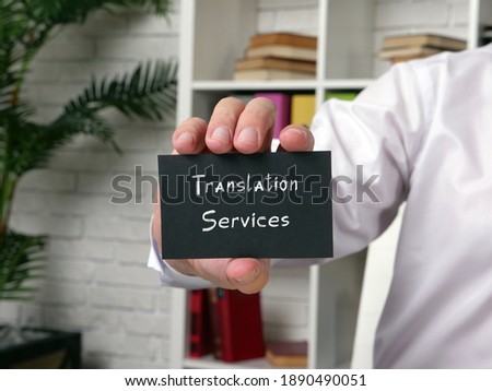  Translation Services phrase on the piece of paper.
