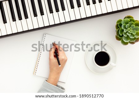 songwriter or dj work place with synthesizer and headphones