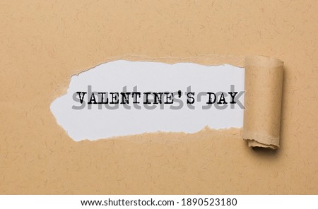 Valentine Day on torn paper background love and valentine concept