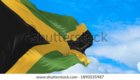 Large flag of Jamaica waving in the wind