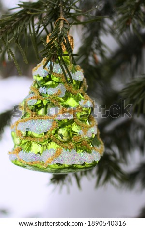 Christmas ball in the form of a Christmas tree. Glass ball handmade