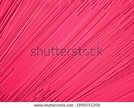 Full screen Abstract background of pink plastic stripes.
