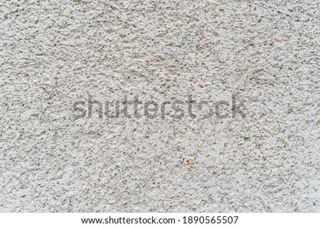 Texture of a wall covered with rubble stone, abstract background, natural color, stock photo