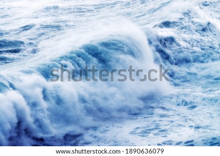 giant waves breaking on a stormy day in atlantic sea ocean