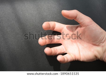 Patient's hand with spasms or neuromuscular disorders, for medical ideas. Royalty-Free Stock Photo #1890651535