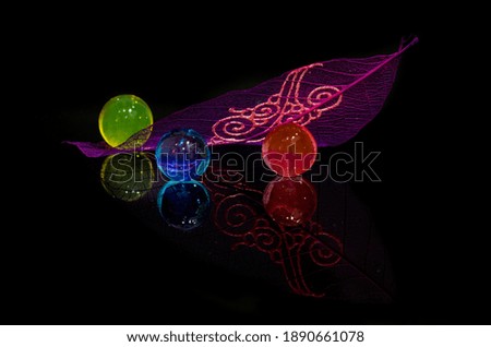 Three color of  waterbeads in black background