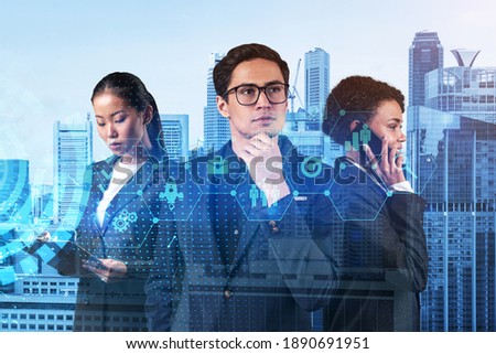 Group of business colleagues trying to find new tech approaches to solve problems at research and development department. Fintech hologram icons over Singapore background.