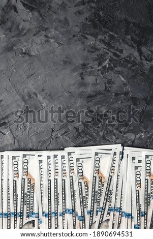 A bundle of money on a dark background. Business concept, salary, opportunities.