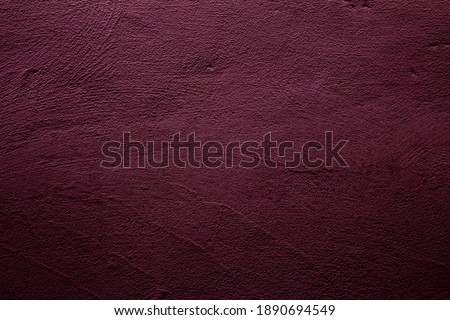 Wine red colored background with textures of different shades of wine red or plum color Royalty-Free Stock Photo #1890694549