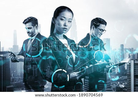 Group of business colleagues working on technology at business process to achieve tremendous growth in commerce. Worldwide process to conduct transactions. Tech hologram icons over Kuala Lumpur