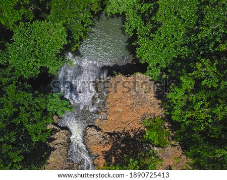 Aerial top view of Marazinne waterfall located in the south of Mauritius island