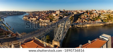 A panorama picture of Porto, showing the city, the Douro river and the Luís I bridge.