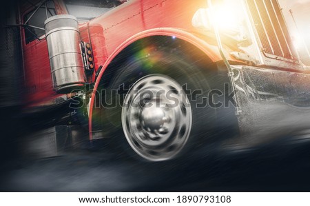 Speeding Powerful Semi Truck in Heavy Rain To the Destination. Front of the Vehicle Close Up. Shipping Your Products Fast in Any Weather Conditions. Professional Experienced CDL Driver. Royalty-Free Stock Photo #1890793108