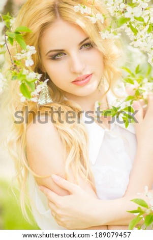 Spring portrait of a beautiful young blonde woman. 