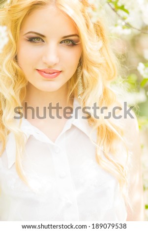 Spring portrait of a beautiful young blonde woman. 