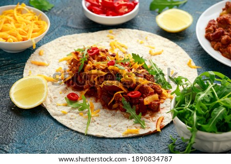 Vegetarian meat free mince filling tortilla wrap burrito with salad