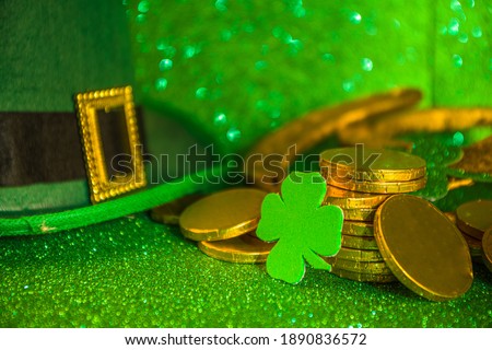 Saint patrick's day greeting background. Patrick's day sale, invitations template, menu. With holiday symbols - golden horseshoe, green clover, leprechaun hat, gold coins, green bokeh background