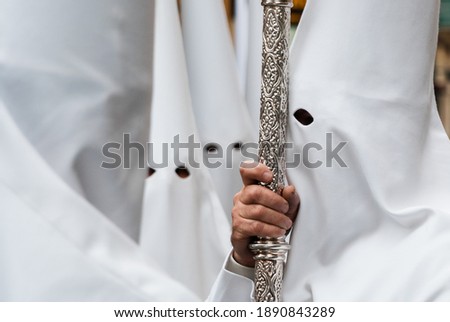 penitents in a white-dressed Easter procession in Almería, southern Spain. Royalty-Free Stock Photo #1890843289