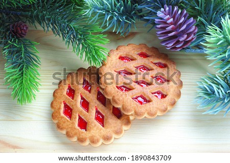 Christmas cookies with marmalade on wooden surface