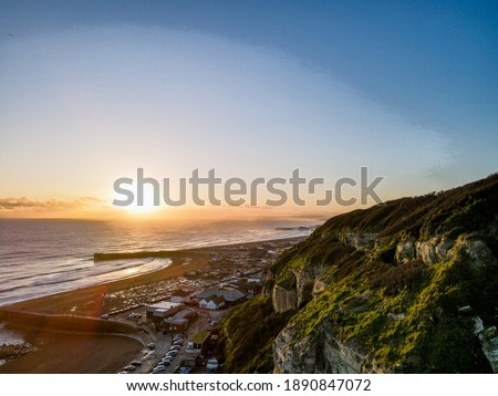 Hastings Old Town shining in the Golden hour sunset at the end of 2020. Cliffs, beaches, character, old meets new, tradition and beauty all captured in one place. Royalty-Free Stock Photo #1890847072