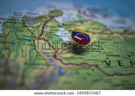 Merida pinned on a map with the flag of Venezuela