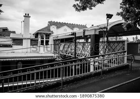black and white photo of a railway station