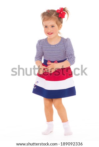  Adorable little girl having fun, she has a good mood. The concept of a happy childhood.Isolated on white background.