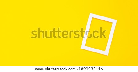 Banner with blank white photo frame on yellow background with copy space, free text place. Framing workshop. Mockup. Layout. Bright festive certificate. Border concept. Summer remembrance. Template.