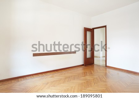 Empty room with wooden floor in normal apartment