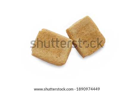 Two cubes of instant broth, bouillon cubes on white background. This file includes clipping path.