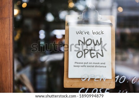 We're back, now open cafe sign after covid-19 pandemic Royalty-Free Stock Photo #1890994879