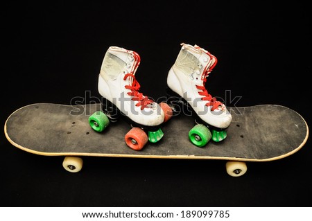 Vintage Style Black Skateboard and Skate Boot on a Dark Background
