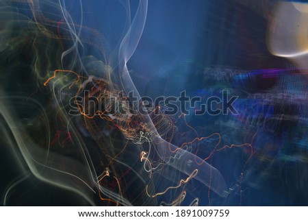 slow shutter speed blur colorful wavy light painting background 