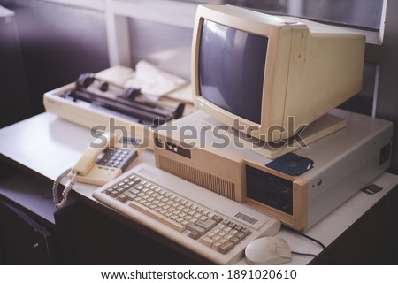 Old office and computer with obsolete technology Royalty-Free Stock Photo #1891020610