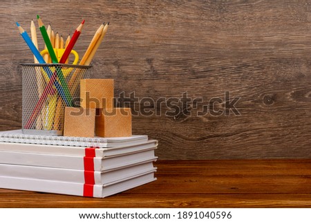 education background with blank cover books and wooden blocks