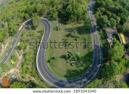 Aerial view of "Khong Ping Ngu" the famous curved road route of Sakon Nakhon Province in northeast, Thailand. (The pictures has noise and film grain)