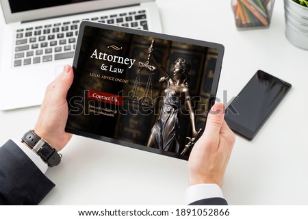 Man seeking legal advice online from law attorney Royalty-Free Stock Photo #1891052866