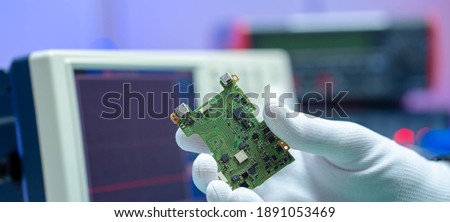 To repair the PCB of a modern monitor at the service center. Laboratory electronic processor technology Royalty-Free Stock Photo #1891053469