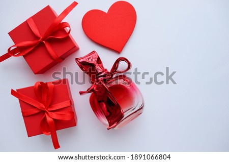 valentine's day background. valentine's day gift concept. gift box on a white background and a red heart.
