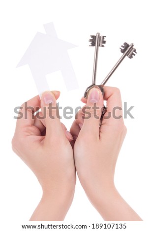 woman hands holding paper house and keys isolated on white background