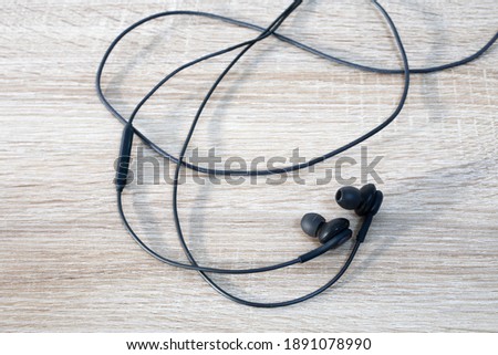 Telephone headphones on a wooden desk. School.