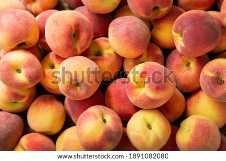 fresh ripe peaches as background, top view Royalty-Free Stock Photo #1891082080