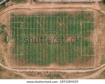 Aerial images of the local soccer field. Summertime picture when the grass is not green, it is damaged from the sun.