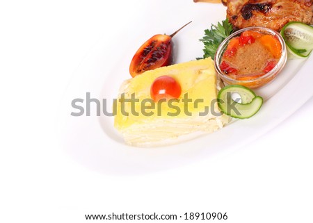 Hazel hen served with mashed potatoes and decorated with vegetables over white background