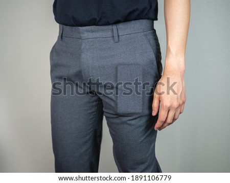 Phone bulge inside trousers on man close up Royalty-Free Stock Photo #1891106779