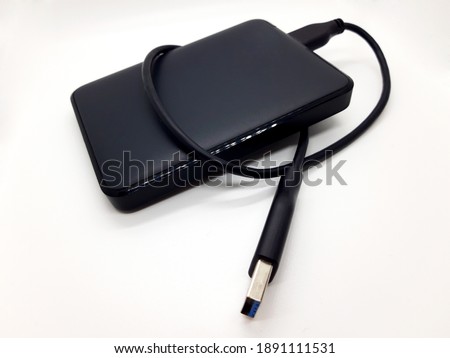 Black external hdd drive with white background.