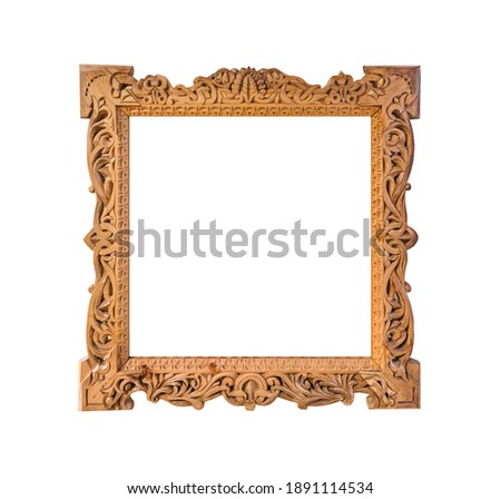 Old wooden photo frame with abstract Russian ornament isolated on white background