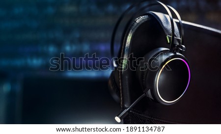 Black headphones in the dark room